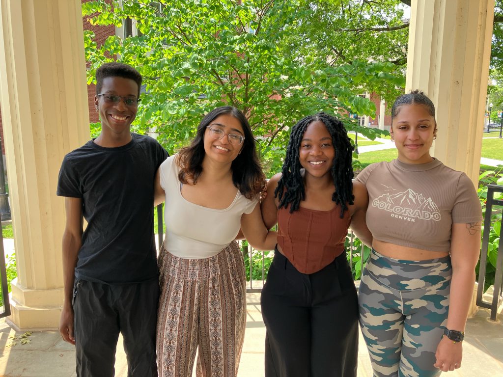 The 2024 DSSRF cohort, four student standing together and smiling.